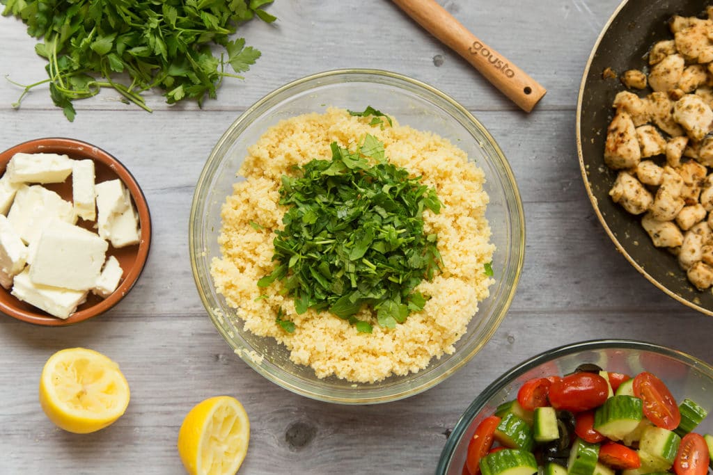 Cooked couscous topped with chopped parsley