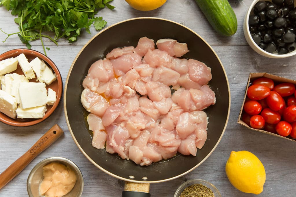 Diced chicken in a frying pan