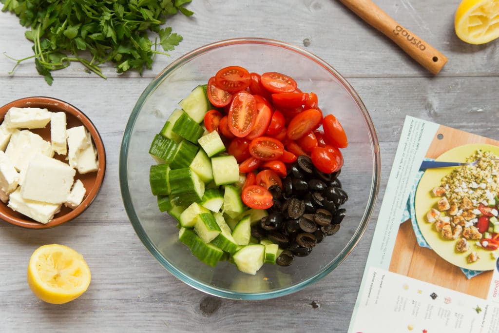 Cucumber, tomatoes and olives in a bowl