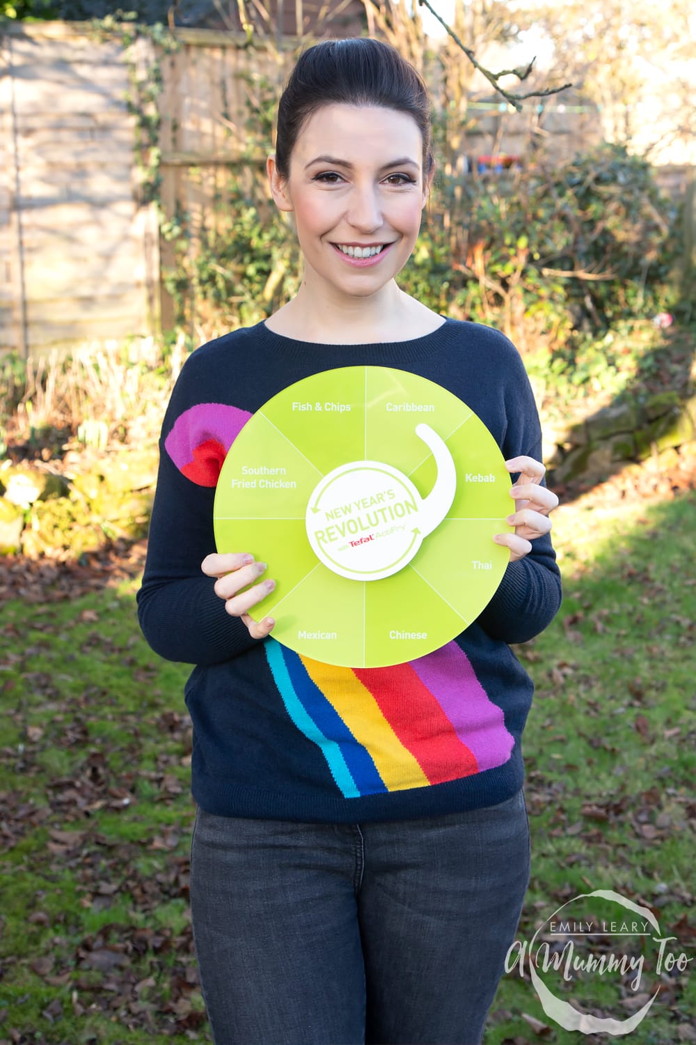 Emily Leary holding a New Year's Resolution wheel