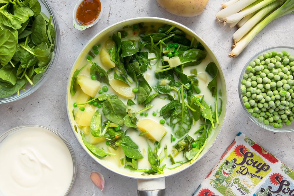 Fresh green soup mixture in a large pan