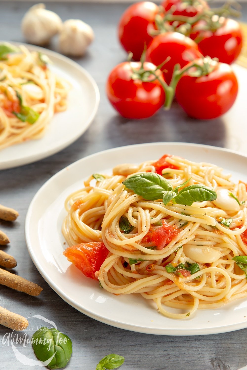 Tomato, bean and garlic spaghetti, served on a plate