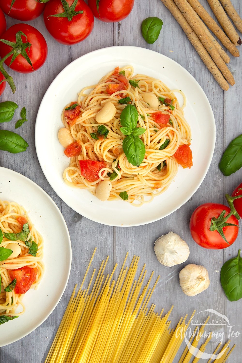 Tomato, bean and garlic spaghetti served on a plate