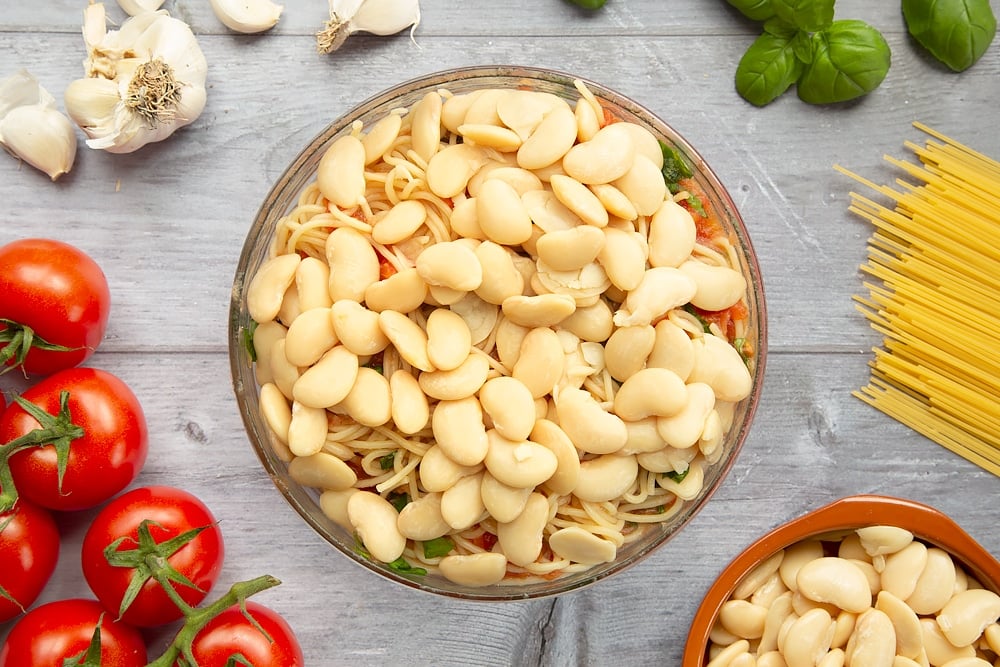 Adding butter beans to the tomato and garlic spaghetti