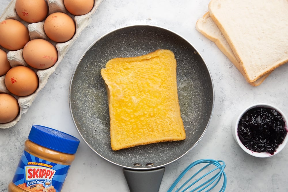 Frying the eggy bread over heat