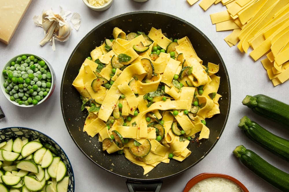 Jamie Oliver's courgette and pea pasta fully prepared in the frying pan.