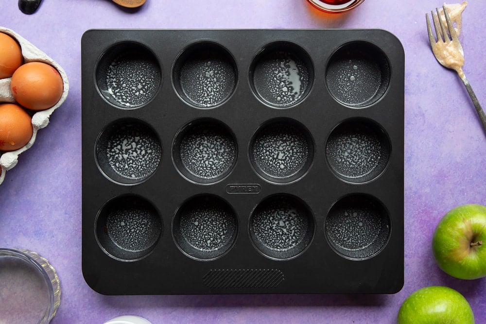 No junk apple and strawberry muffins - oiled muffin tin.