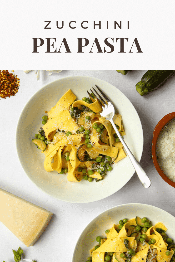 Overhead shot of two bowls of courgette and pea pasta by Jamie Oliver on a white table. At the top of the image there's some text describing the image for Pinterest.