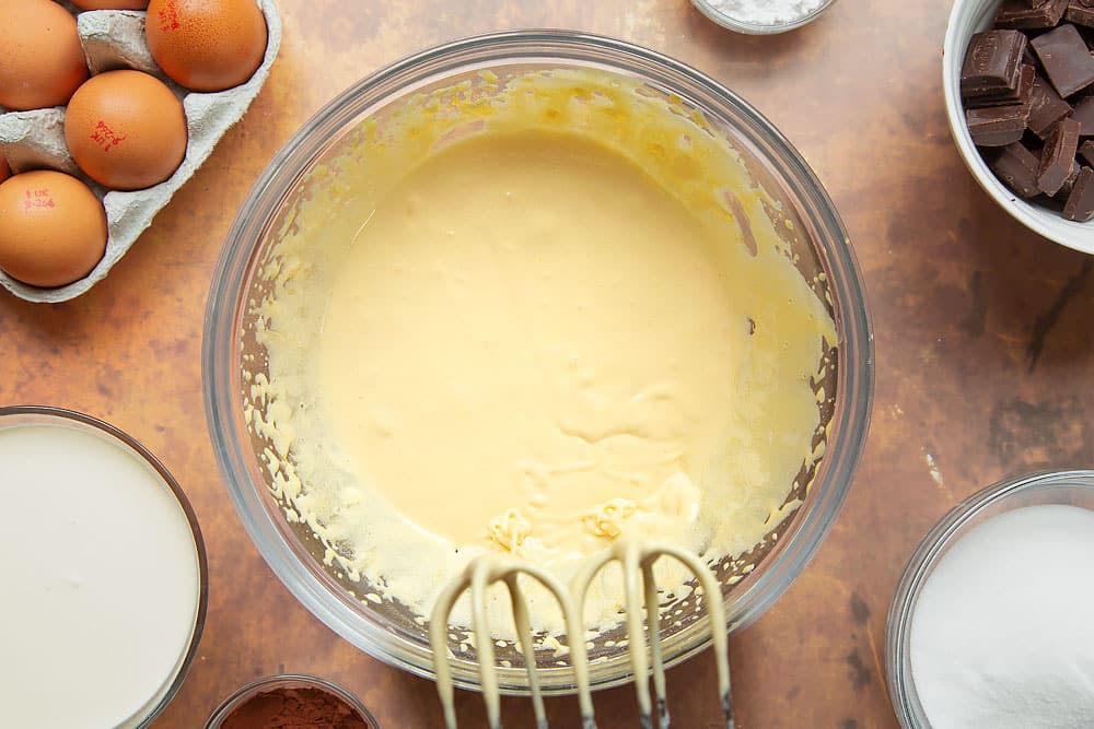 Egg yolks and caster sugar in a mixing bowl, beaten to ribbon stage.