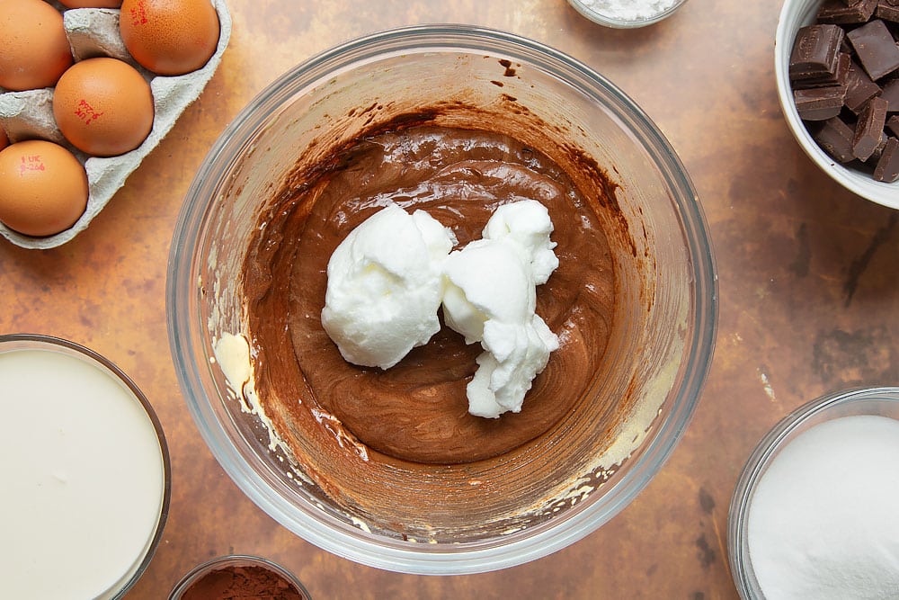 Egg yolks and sugar folded together with melted dark chocolate, and a little beaten egg white added. 