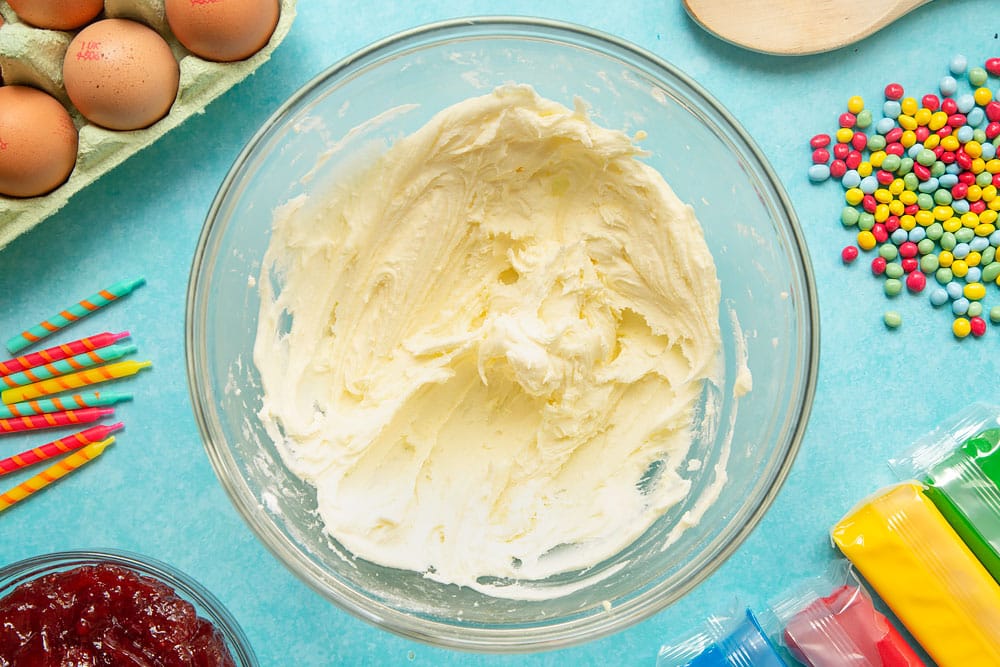 Vanilla, icing sugar and butter beaten to form a buttercream frosting in a mixing bowl