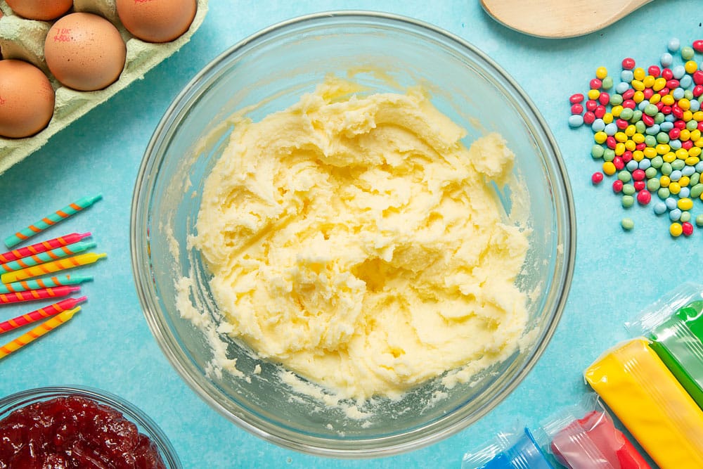 Butter and sugar in a mixing bowl, beaten together