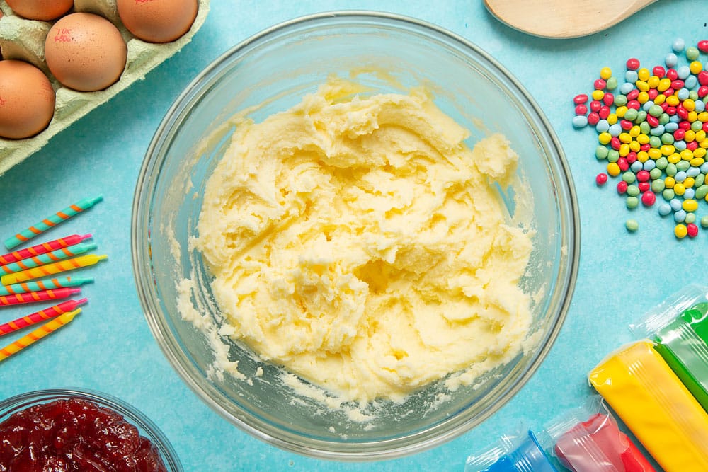 Butter and sugar in a mixing bowl, beaten together