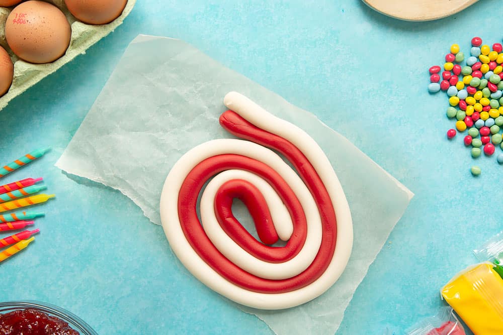 Red and white sugar paste rolled into lengths