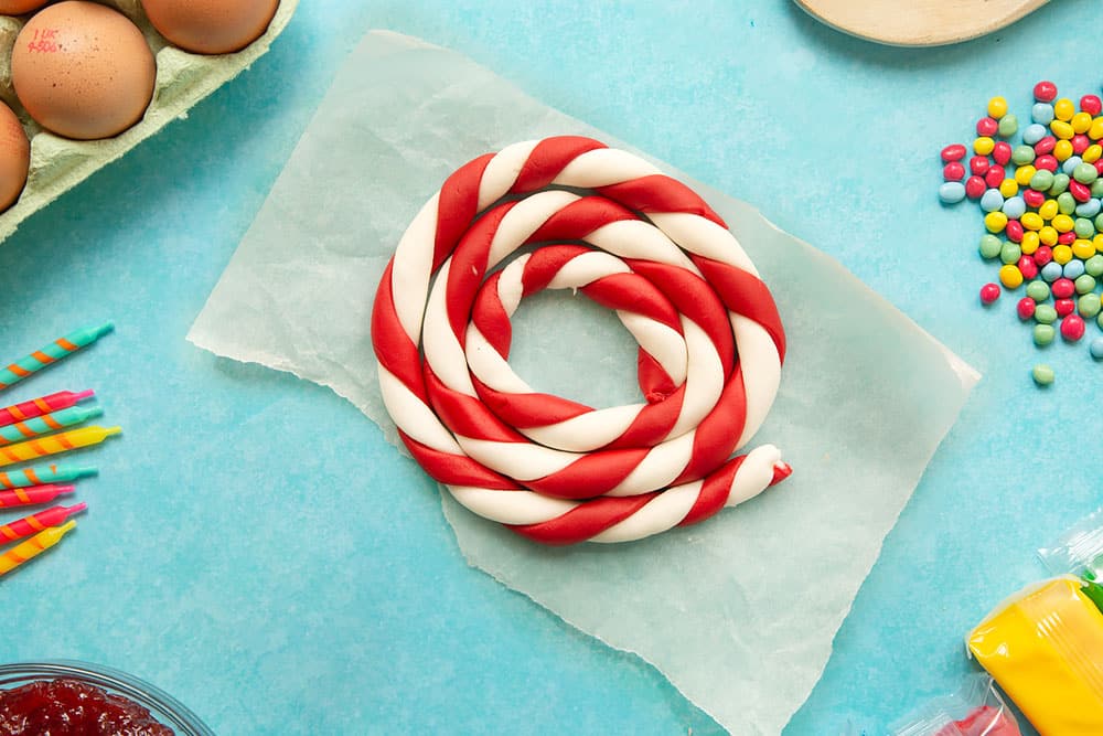 Red and white lengths of sugar paste, twisted together and rolled to form a candy cane stripe