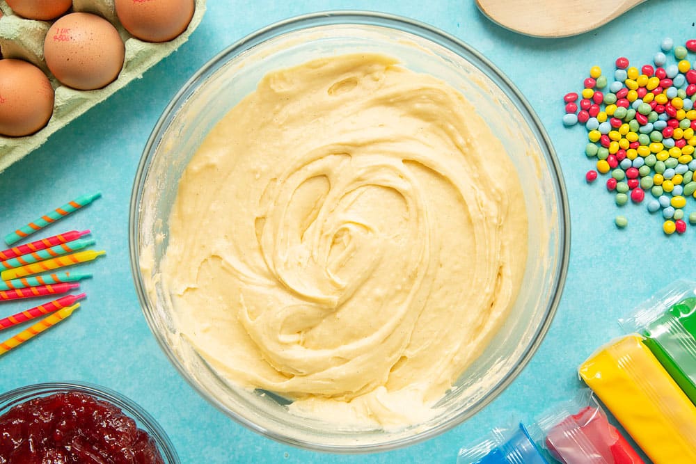 Eggs, vanilla, sugar and butter and self-raising flour folded together to form a Victoria sponge batter