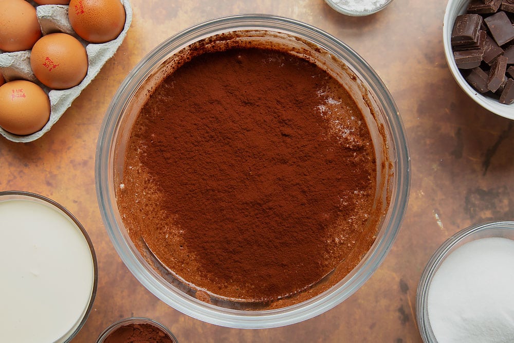 Cocoa added to flourless chocolate sponge batter.