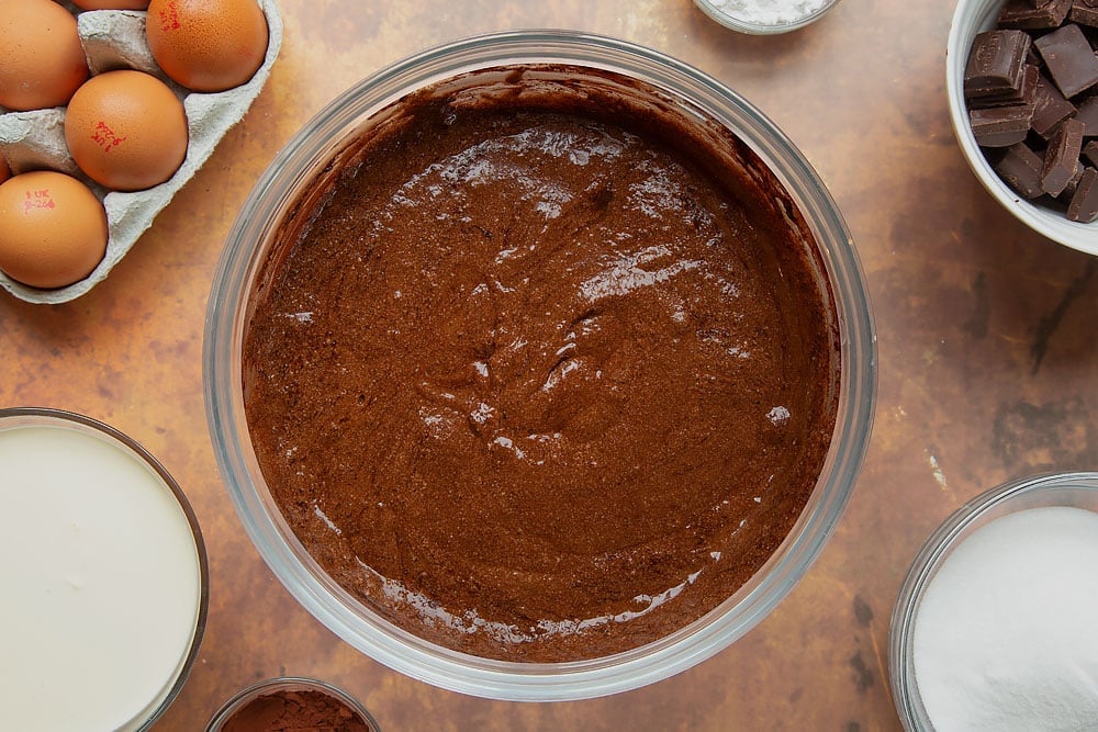 Cocoa folded through flourless chocolate roulade batter.