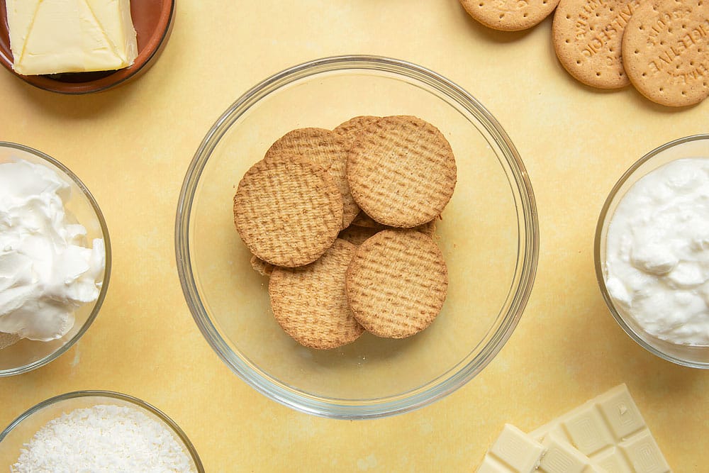 Digestive biscuits in a mixing bowl