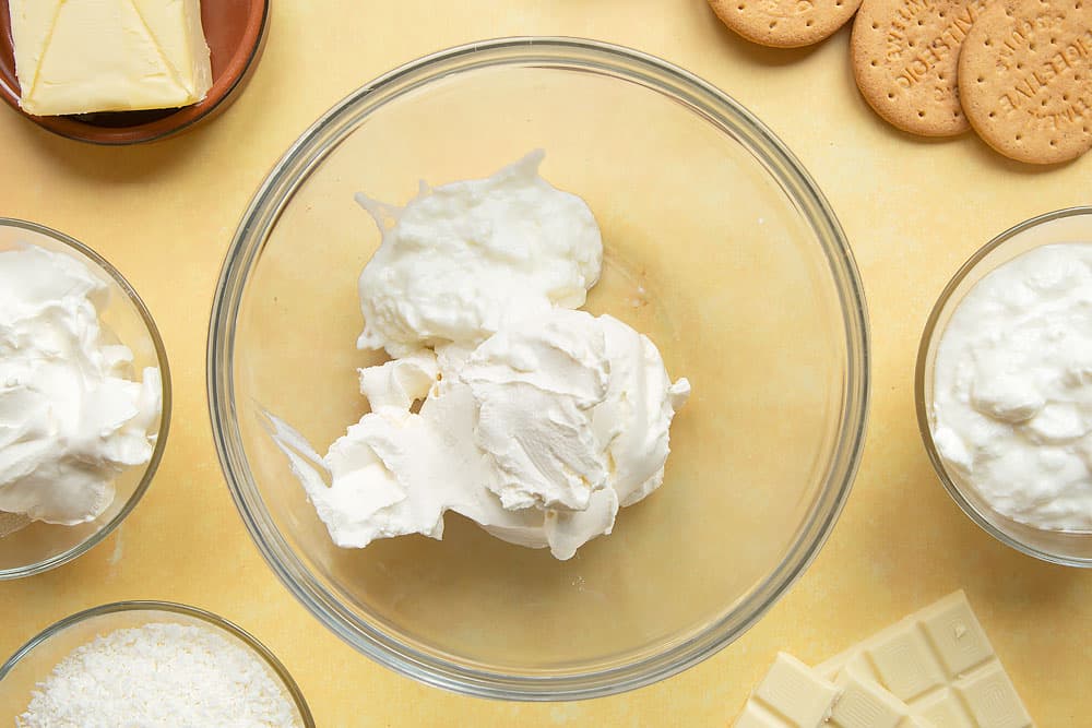 Cream cheese and yogurt in a large mixing bowl.