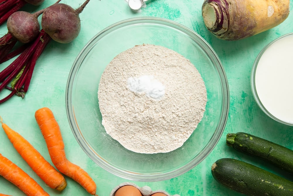 Vegetable soda bread rolls recipe - a bowl with wholemeal flour and baking powder.