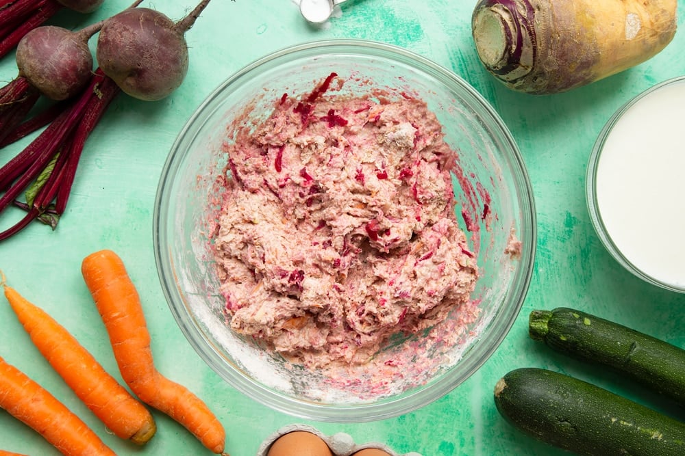 Vegetable soda bread rolls recipe - a bowl with dough with grated vegetables mixed in, turning it pink with coloured flecks.