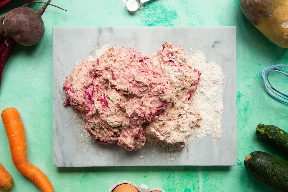 Vegetable soda bread rolls recipe - the pink dough turned onto a floured board.