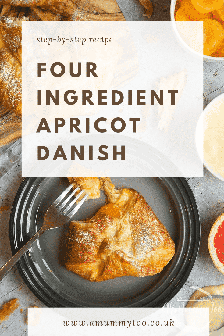 Overhead shot of a finished four ingredient apricot danish on a black plate. At the top of the image there's some text describing the image for Pinterest.