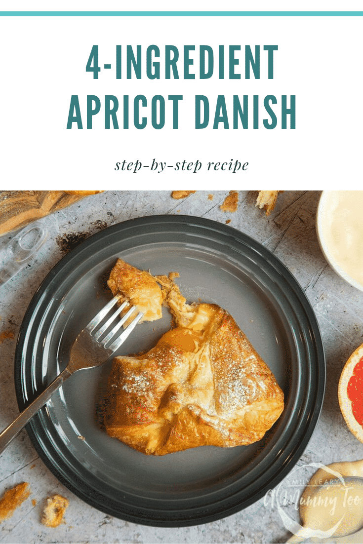 Overhead shot of the four ingredient apricot Danish on a black plate with a fork on the side. 