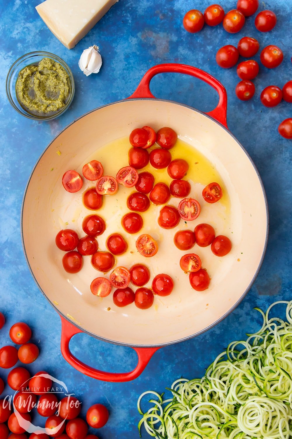 Cherry tomatoes, garlic, olive oil, black pepper and spiralised courgette in a frying pan