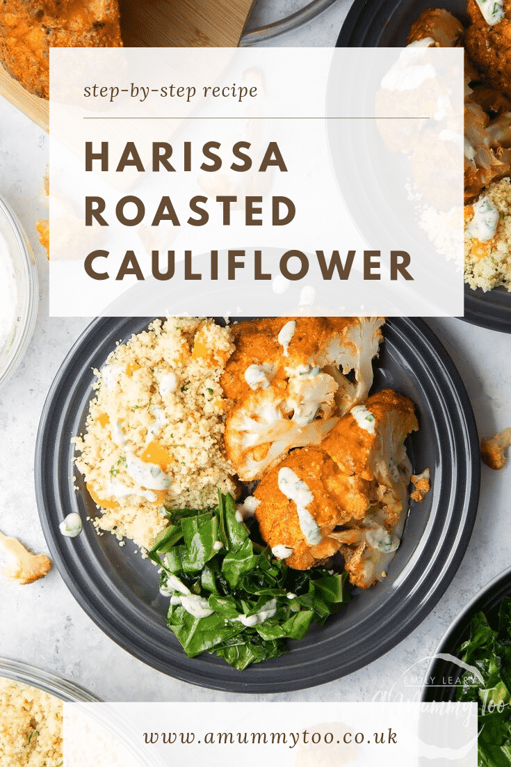 Overhead shot of the Harissa Roasted Cauliflower on a black plate with a side of cous cous and roasted spinach. At the top of the image there's some text describing the image for Pinterest. 