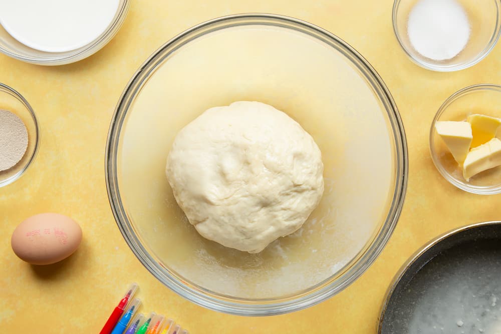 Kneaded tangzhong bread dough ball in an oiled bowl