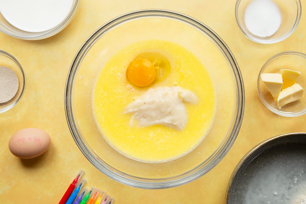 Egg and tangzhong to a mix of sugar, warm milk and warm butter in a large bowl.
