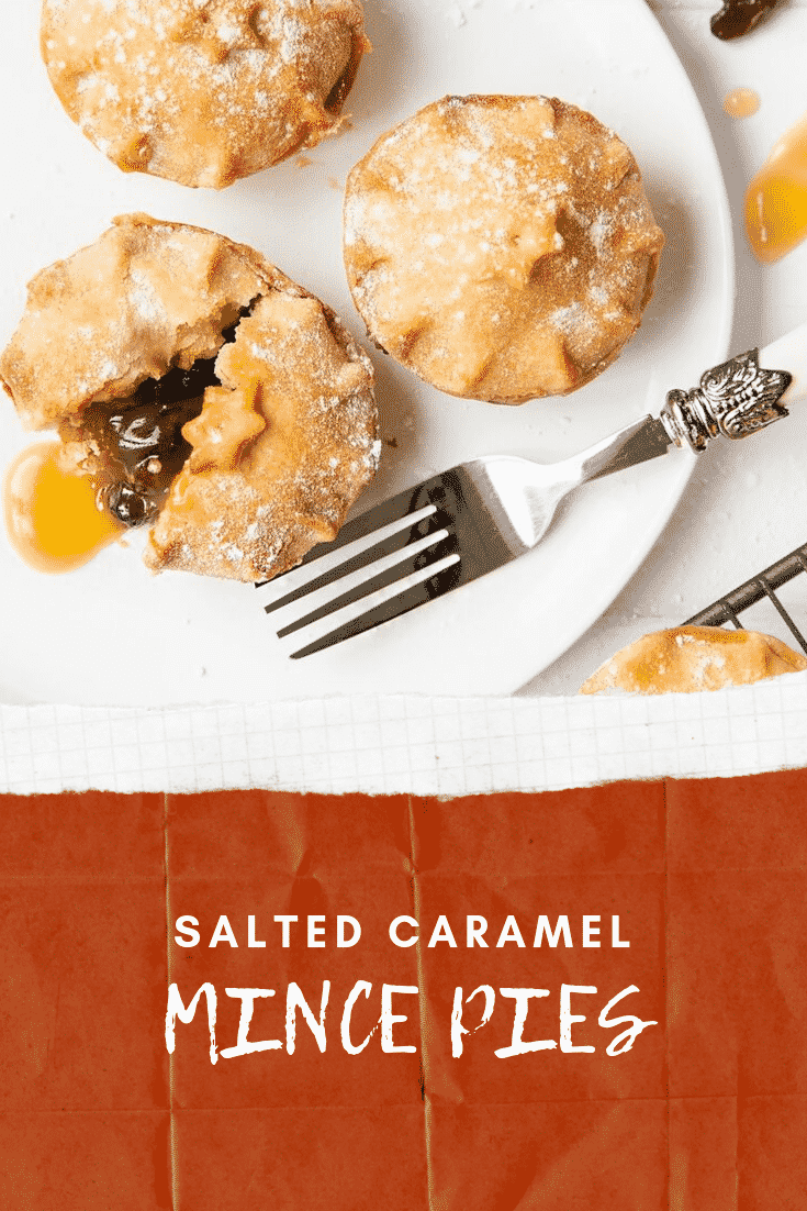 Overhead shot of three mince pies on a white plate with a decoative fork on the side. At the bottom of the image there's some white text on a red backgrpound descirbing the image for Pinterest. 