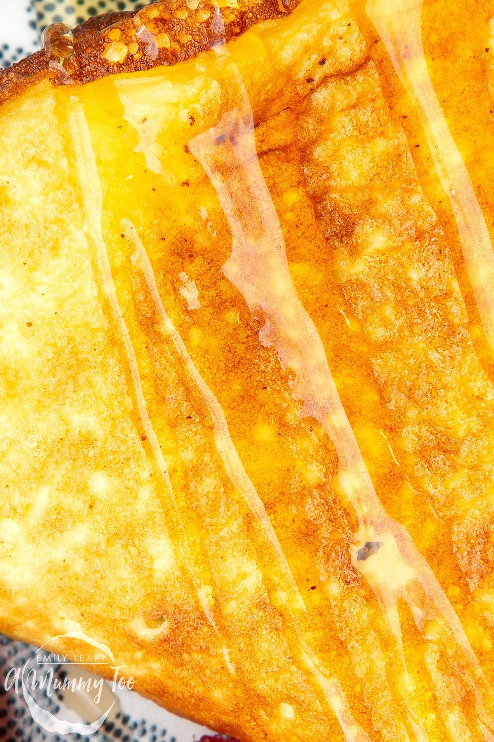 Sweet breakfast omelette, very close up to show the texture, drizzled with honey