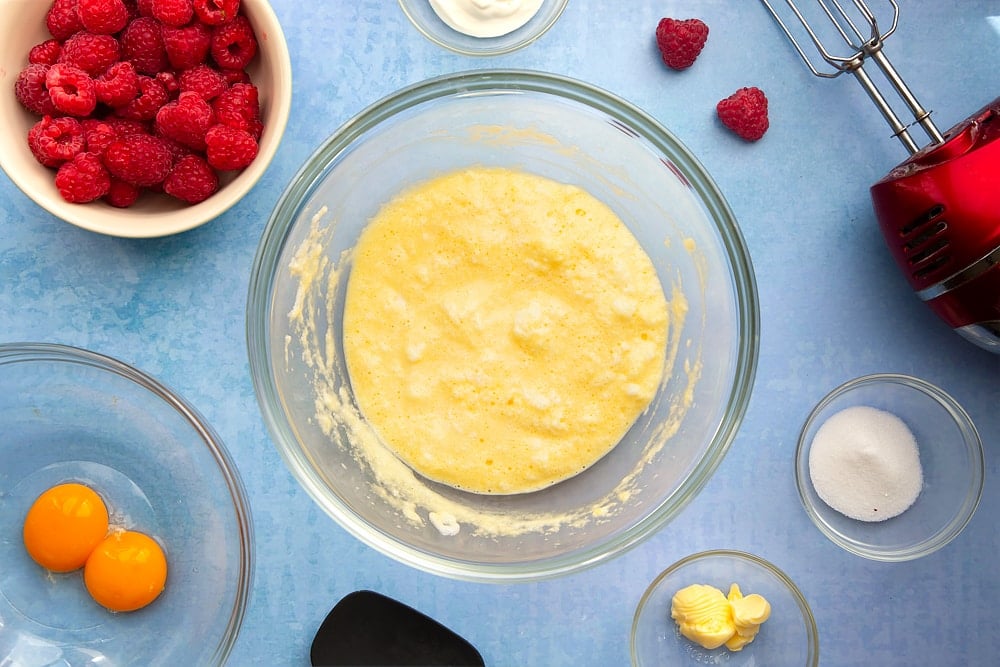 Mixing bowl containing beaten egg whites, egg yolks, yogurt and sugar folded together to form the breakfast omelette mix