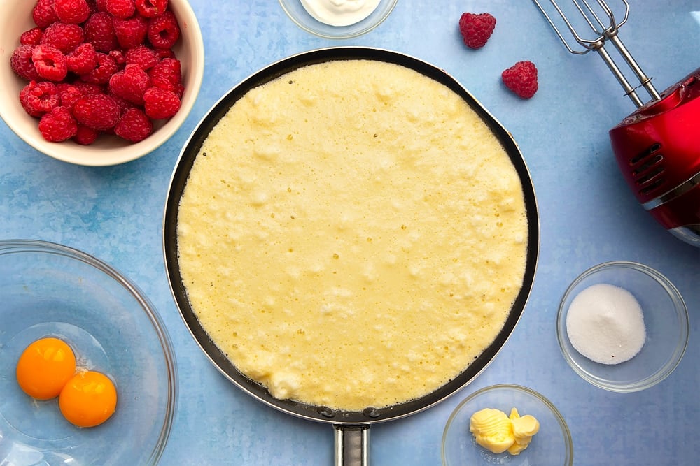 Large nonstick pan containing the uncooked sweet omelette mixture