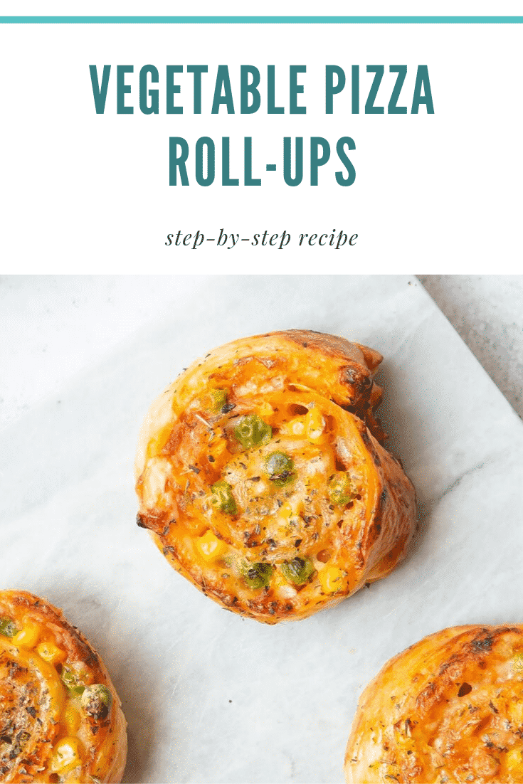 Close up overhead shot of pizza roll ups on a white sheet. At the top of the image there's some teal text describing the image for Pinterest.