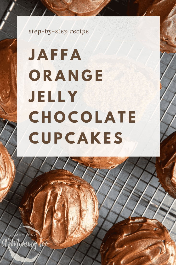 Overhead shot of multiple jaffa orange jelly chocolate cupcakes cooling on a wire rack. At the top of the image there's some brown text on a white background describing the image for Pinterest. 