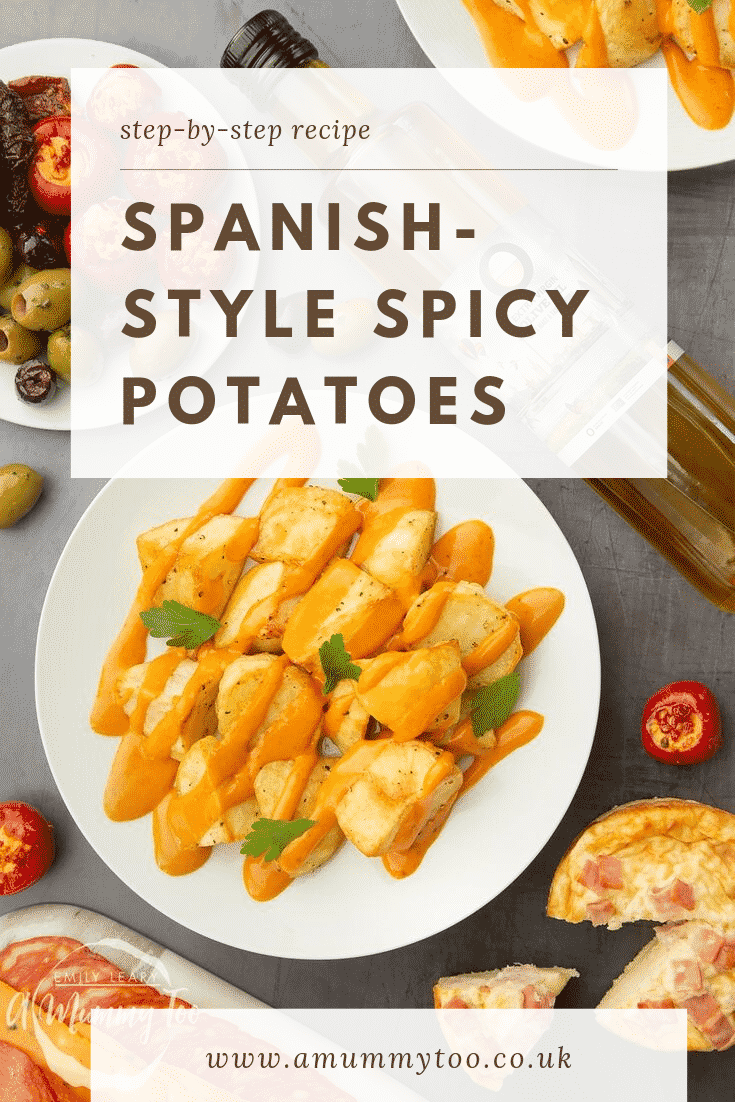 Overhead shot of Spanish-style potatoes on a white plate which is sat on a black background. At the top of the image there's some brown text describing the image for Pinterest. 