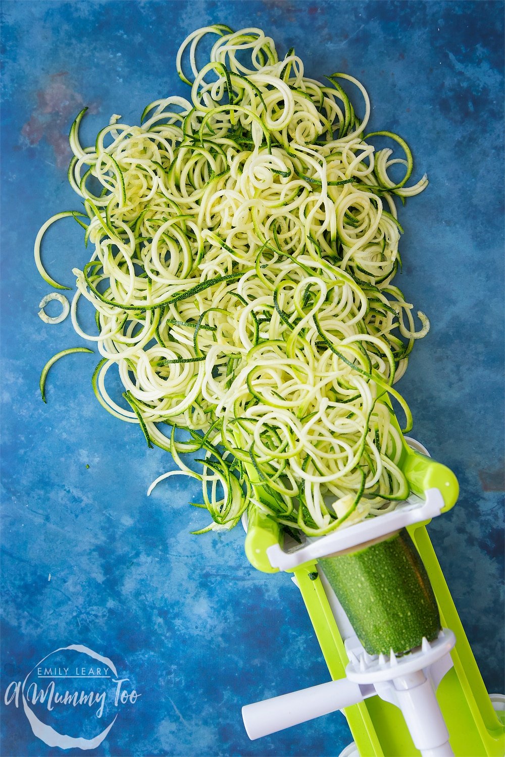 Spiralised courgette coming out of a spiraliser