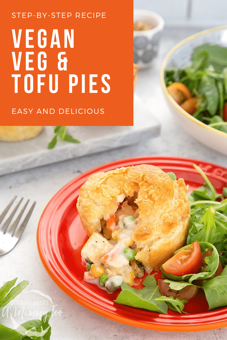 A cut open vegan pie sits on a red plate with a side salad. At the top right hand side there's some white text on a orange backgroiund describing the image for Pinterest.