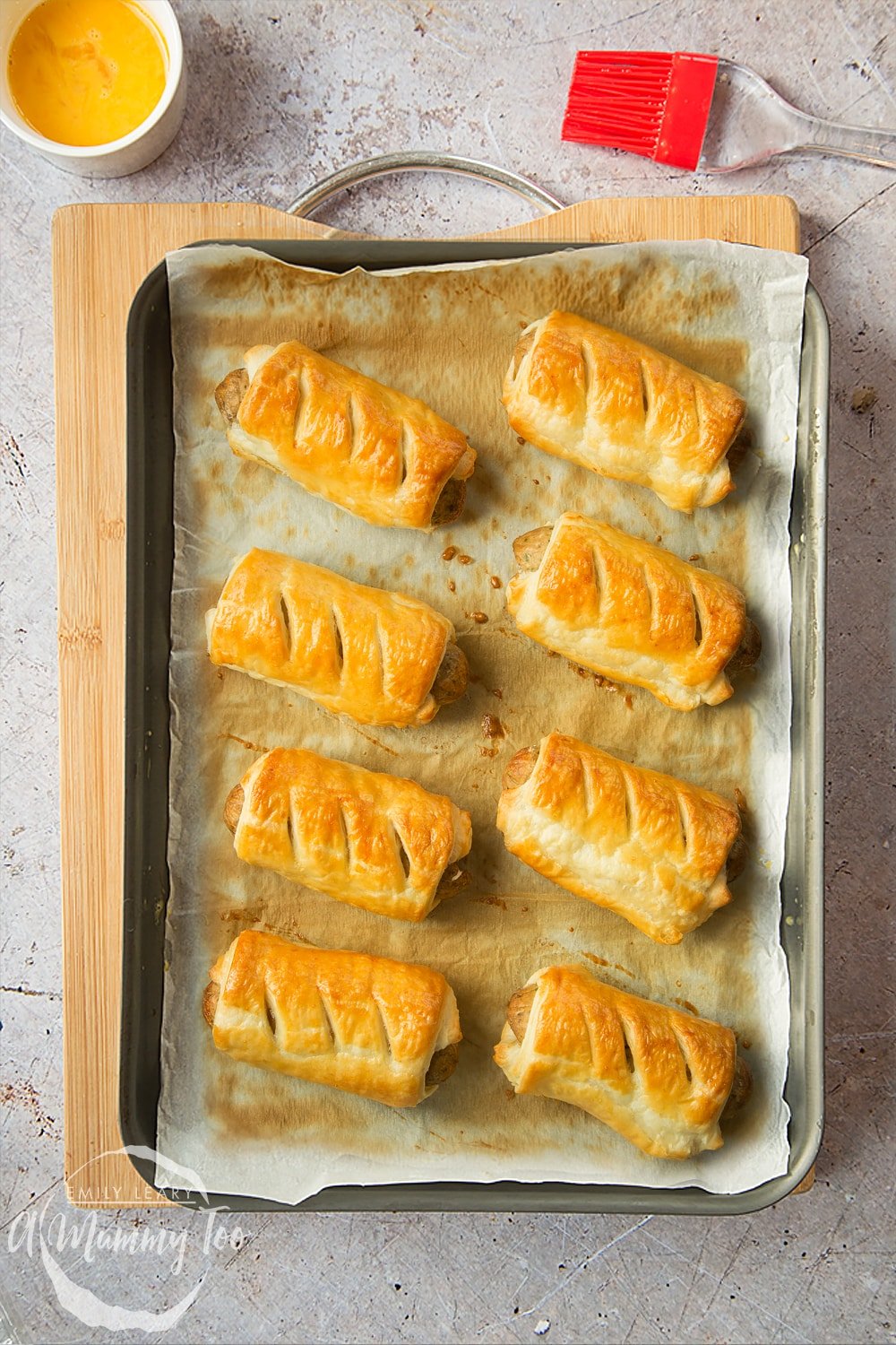 Vegetarian sausage rolls on a baking tray, freshly cooked.