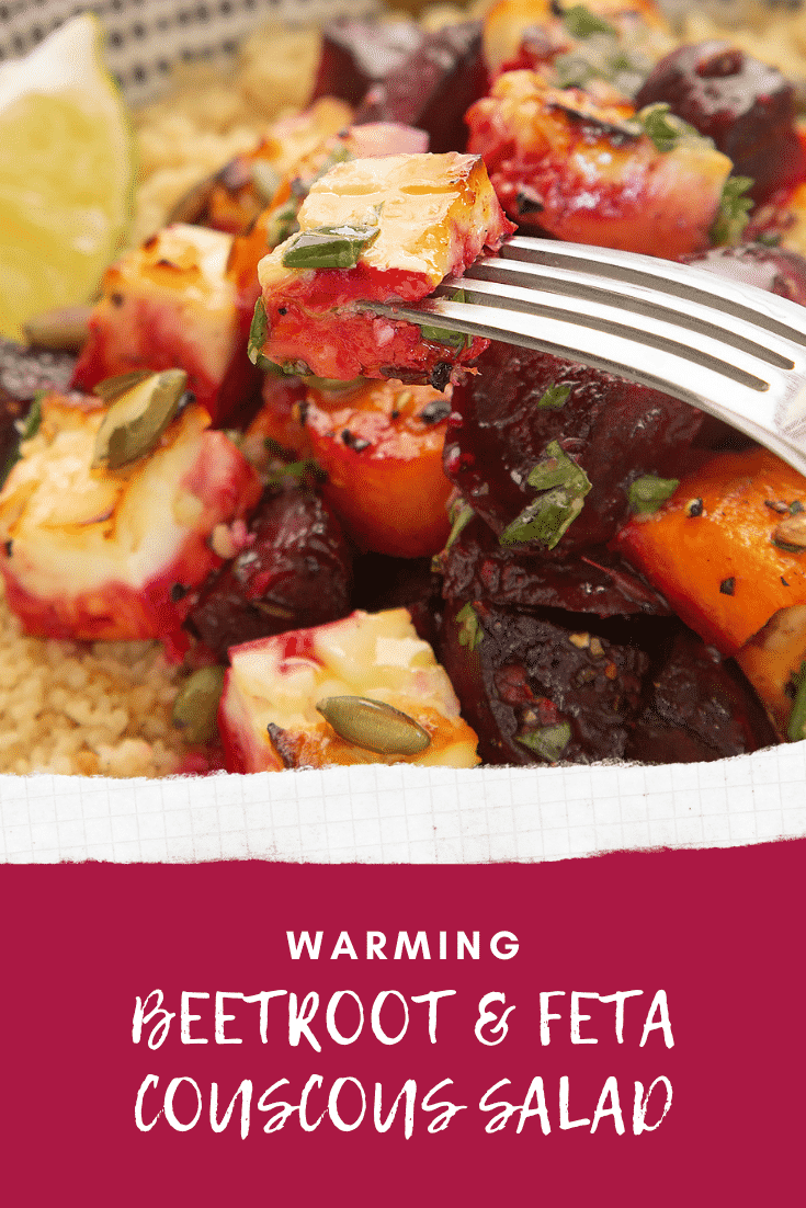 Close up of a fork with some chopped beetroot coming out from a bowl filled with Beetroot and feta salad with couscous. At the bottom of the image theres some white text describing the image for Pinterest. 