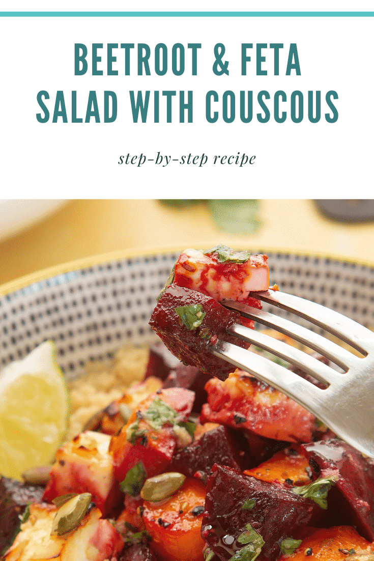Side on view of some chopped beetroot coming out of a decoative bowl filled with Beetroot and feta salad with couscous. At the top of the image there is some teal text describing the image / recipe for Pinterest.