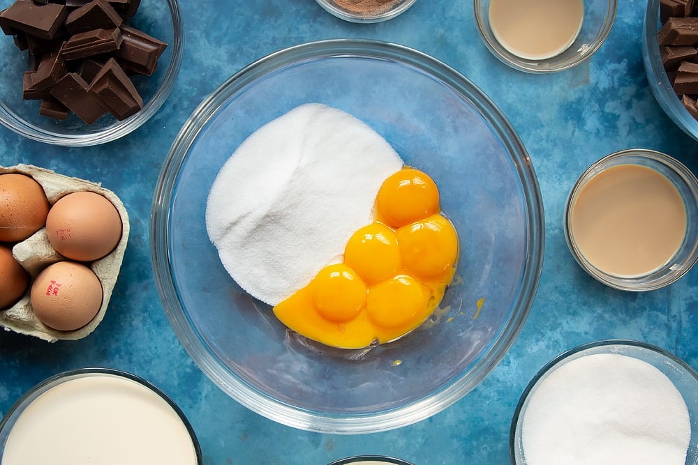 A bowl of eggs and sugar, two of the essential ingredients required to create the baileys triple chocolate trifle