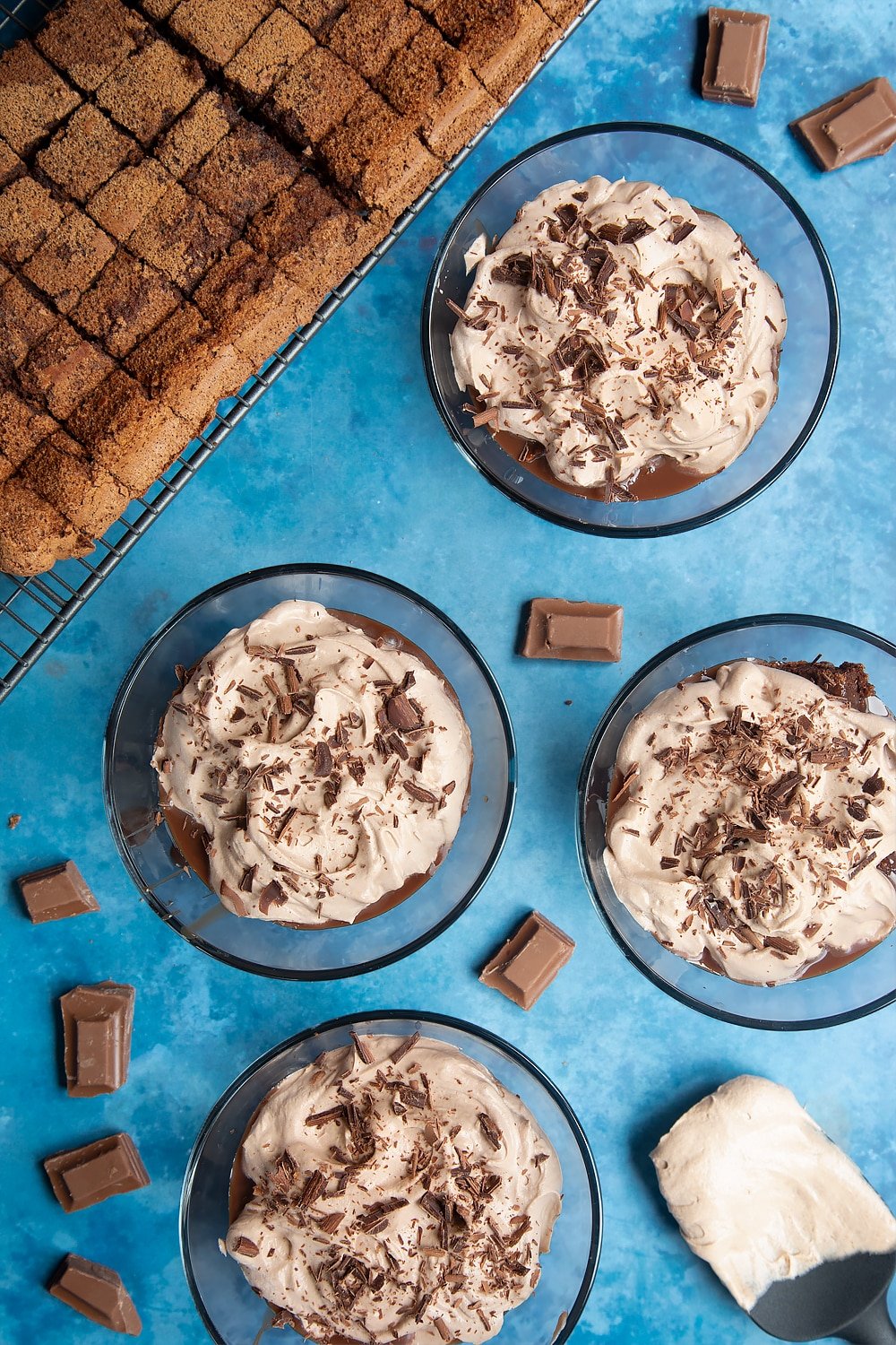 Finishing the baileys triple chocolate trifle desert bowl with grated dark chocolate.