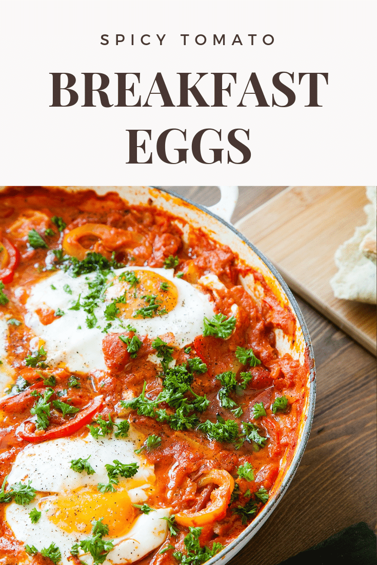 graphic text: SPICY BREAKFAST EGGS above a front view of spicy breakfast eggs in tomato sauce in a casserole dish