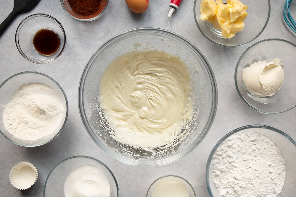 Cream cheese frosting having been mixed together in a bowl.