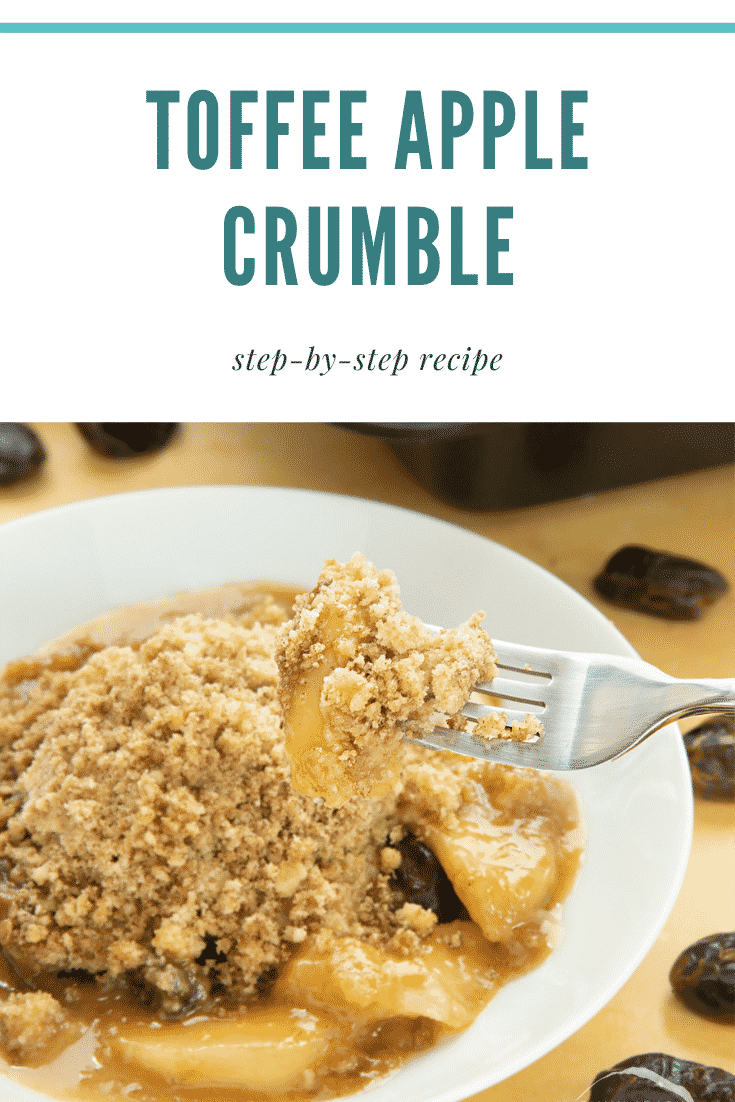 A fork taking out some of the toffee apple crumble. At the top there's some text describing the image for Pinterest